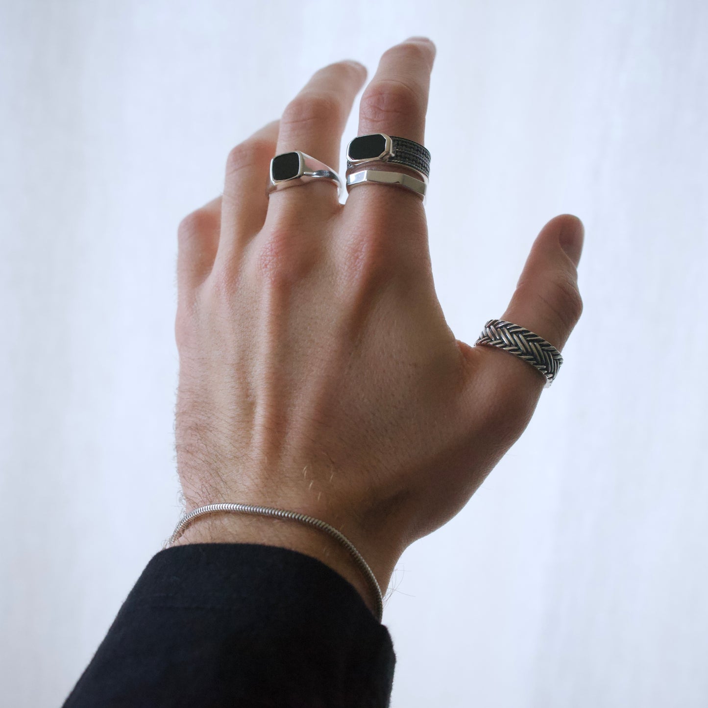 Model wearing a range of high quality men's 925 sterling silver rings
