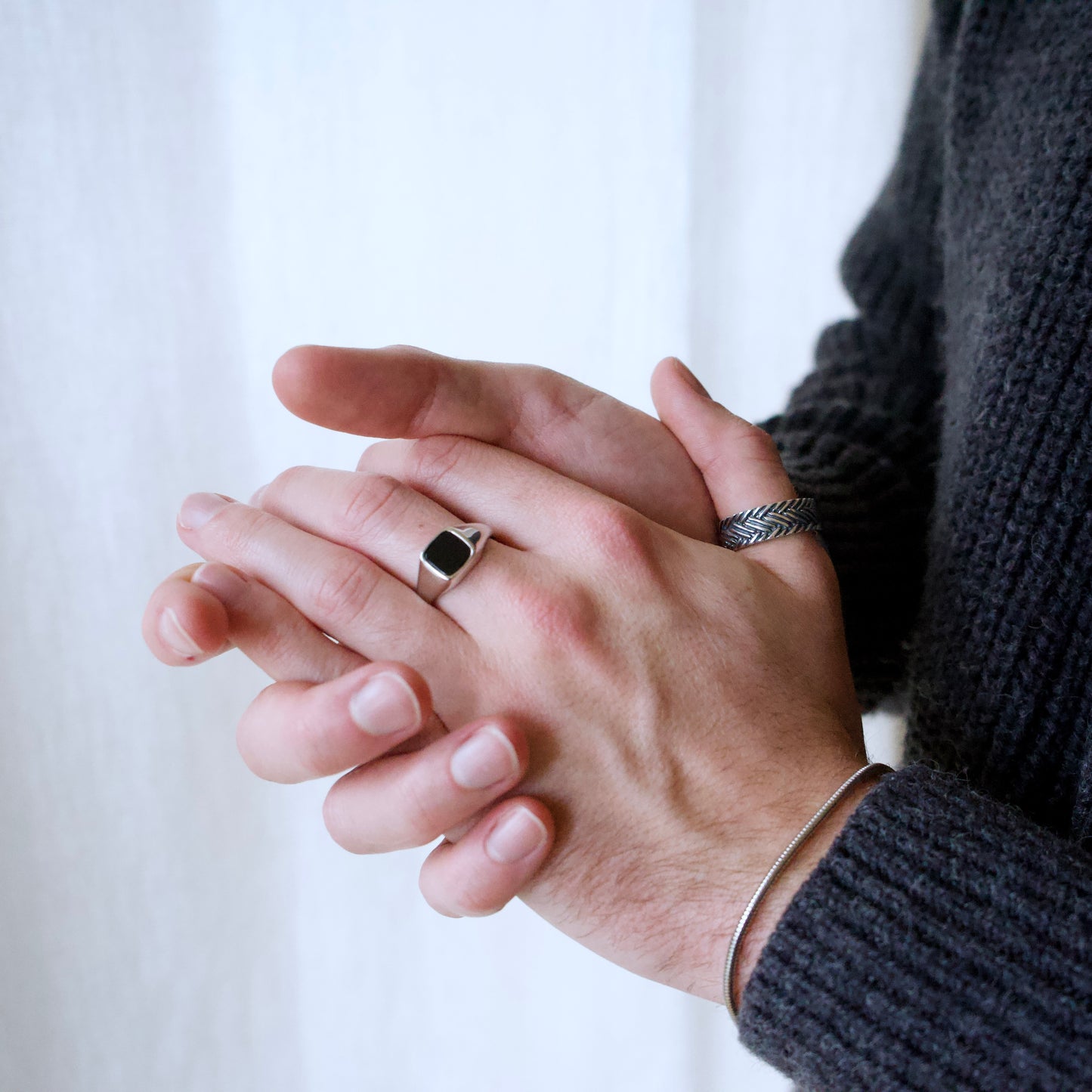 Model wearing a range of high quality men's 925 sterling silver rings