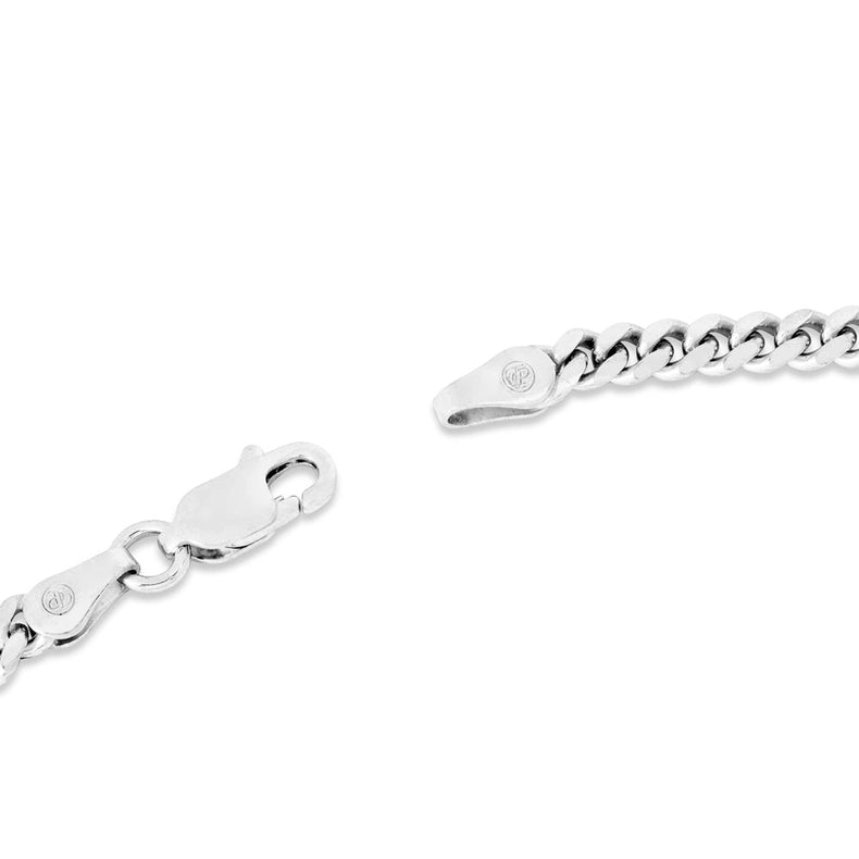 Silver chain bracelet with clasp on a white background
