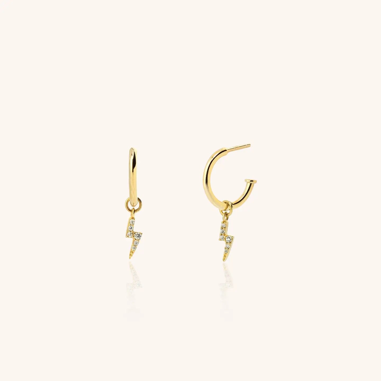 Women's 18k gold plated earrings with lightening bolt on white background