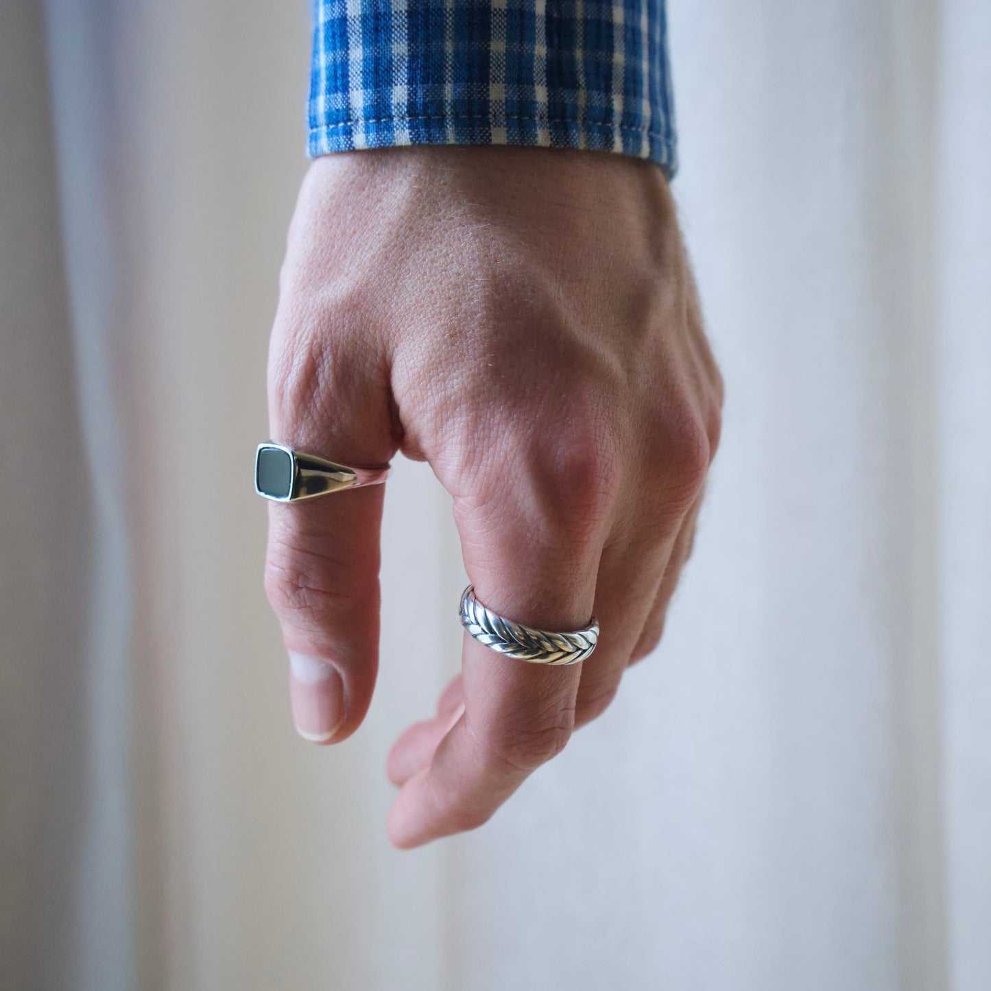 Model wearing a range of high quality men's 925 sterling silver rings