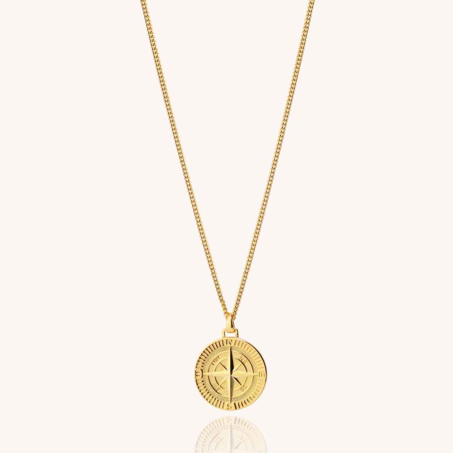 Men's 18k gold plated compass necklace on a white background