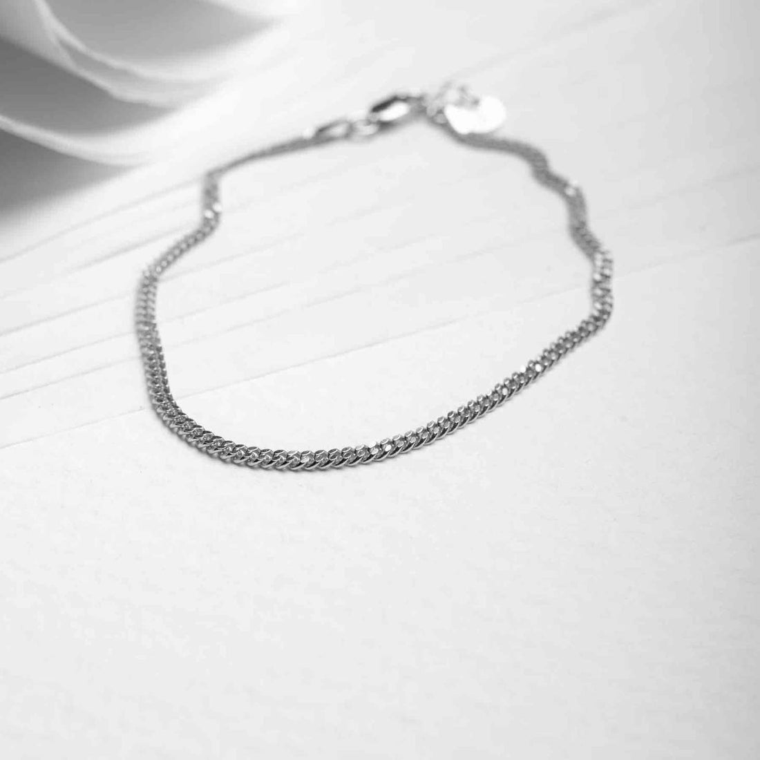 Image of a 925 sterling silver chain bracelet, which is a common type of bracelet, on a white background