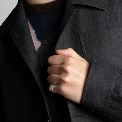 Male model wearing a 925 Sterling Silver signet ring on his pinky finger