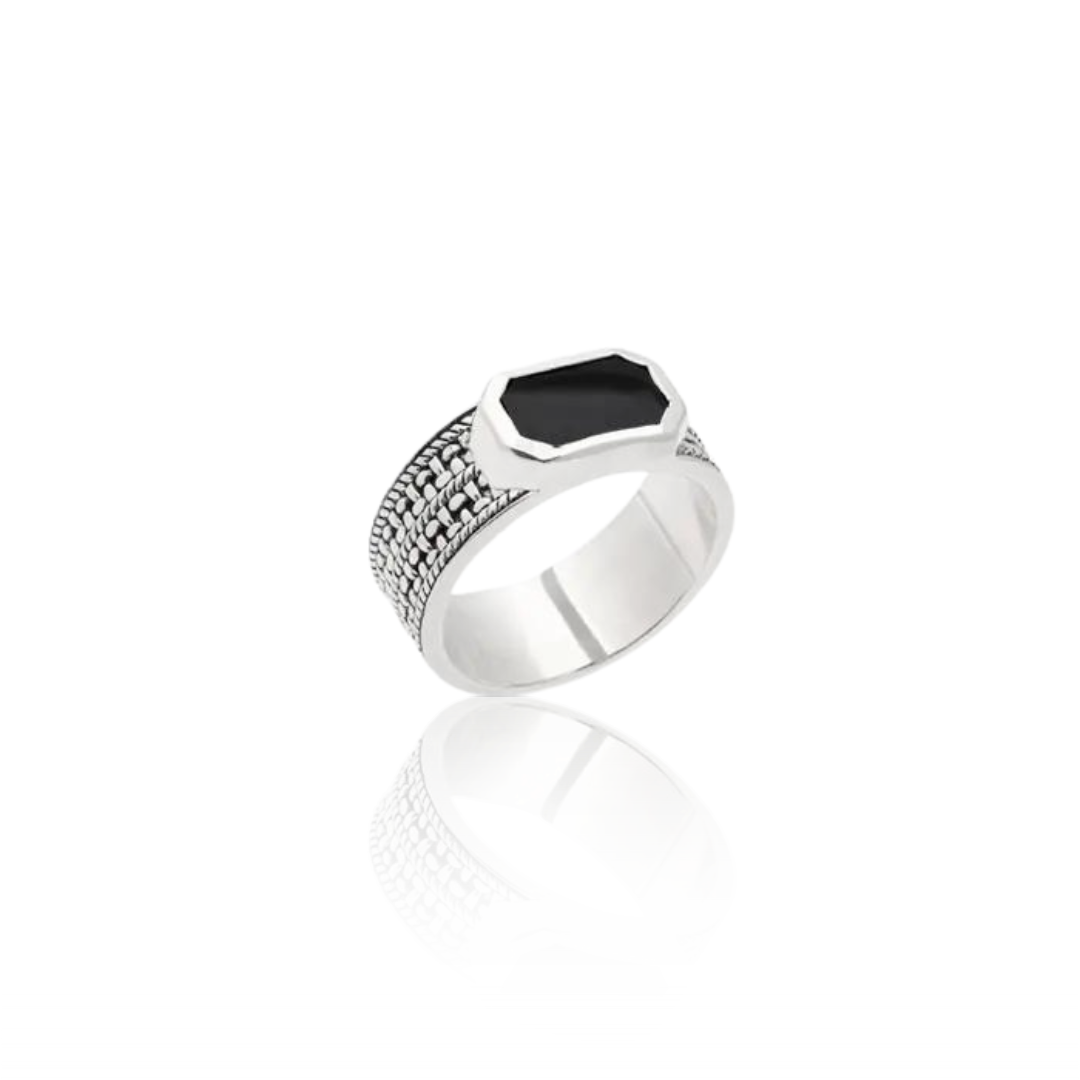 Men's 925 sterling silver black agate signet ring from a side angle on white background