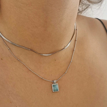 Women wearing a 925 sterling silver necklace with a blue amazonite stone pendant