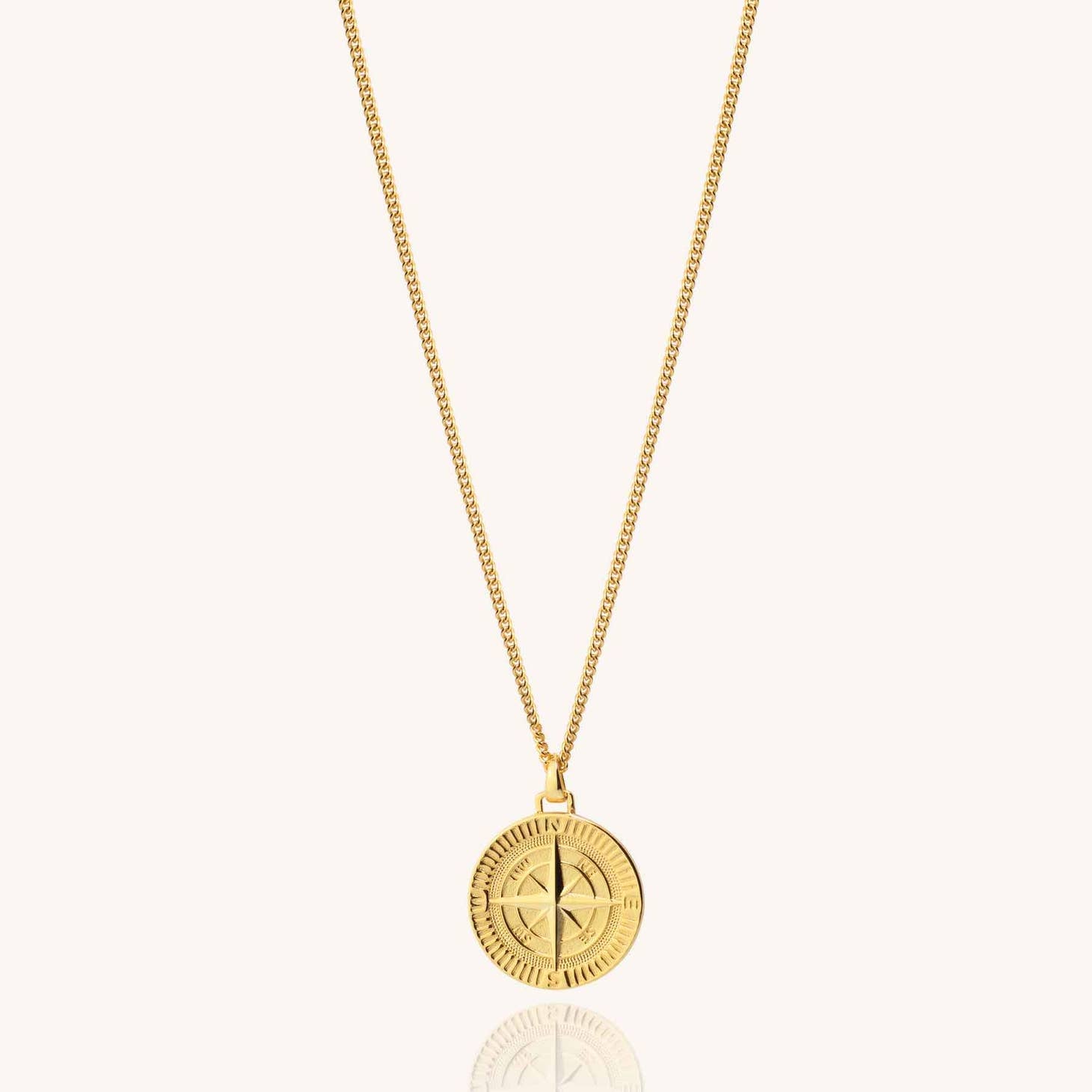 Men's 18k gold plated compass necklace on a white background
